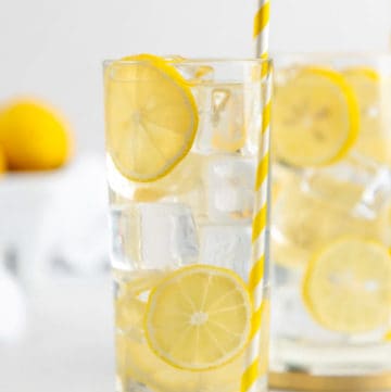 a glass of homemade lemonade garnished with lemon slices.