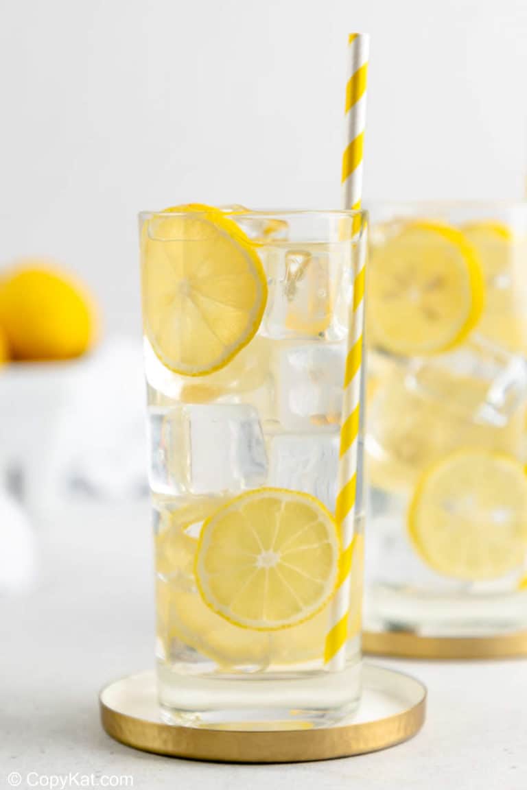 a glass of homemade lemonade garnished with lemon slices.