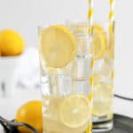 two glasses of homemade lemonade on a tray.