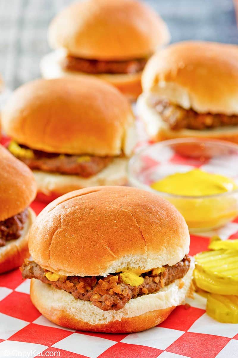 homemade Krystal burgers on parchment paper.