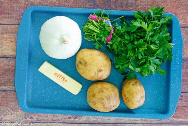 lyonnaise potatoes ingredients on a tray.