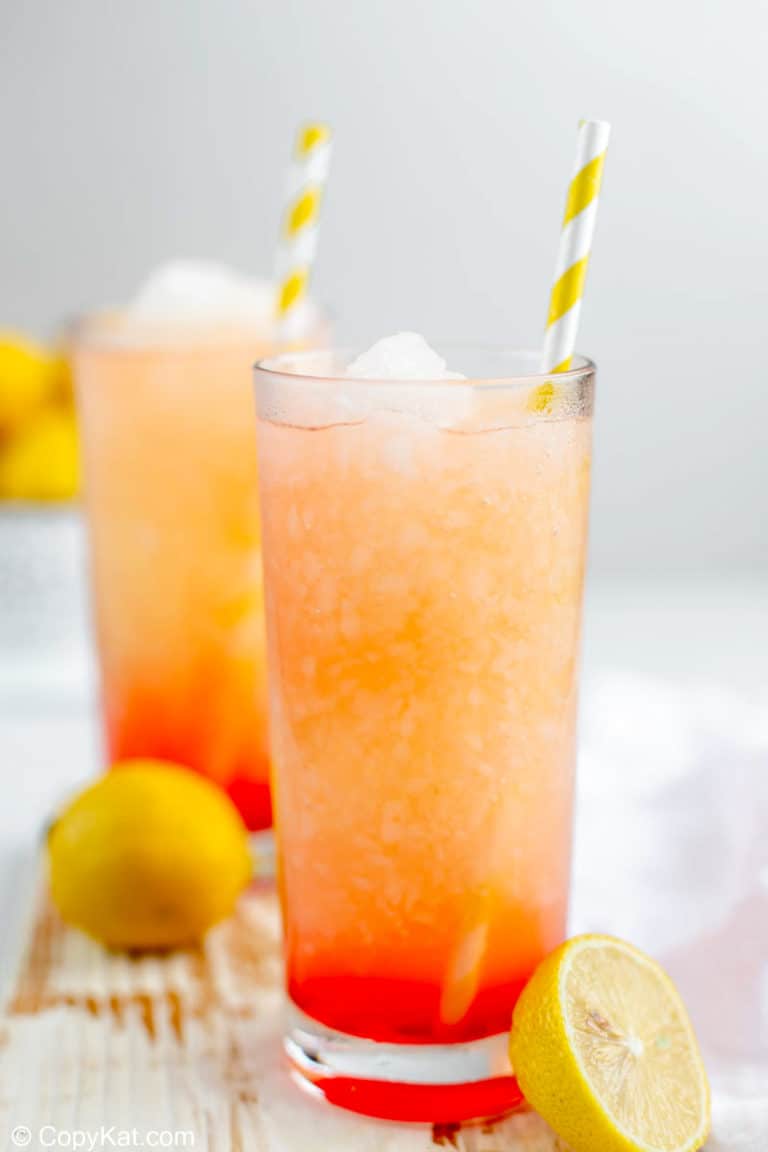 homemade McDonald's frozen strawberry lemonade in glasses with straws.