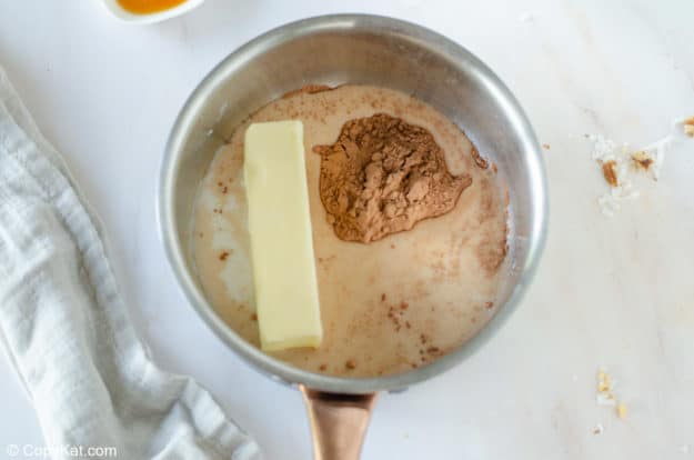 butter, cocoa, and milk in a pan.
