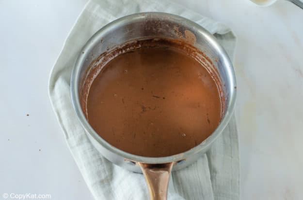 melted butter, cocoa, and milk combined in a pan.