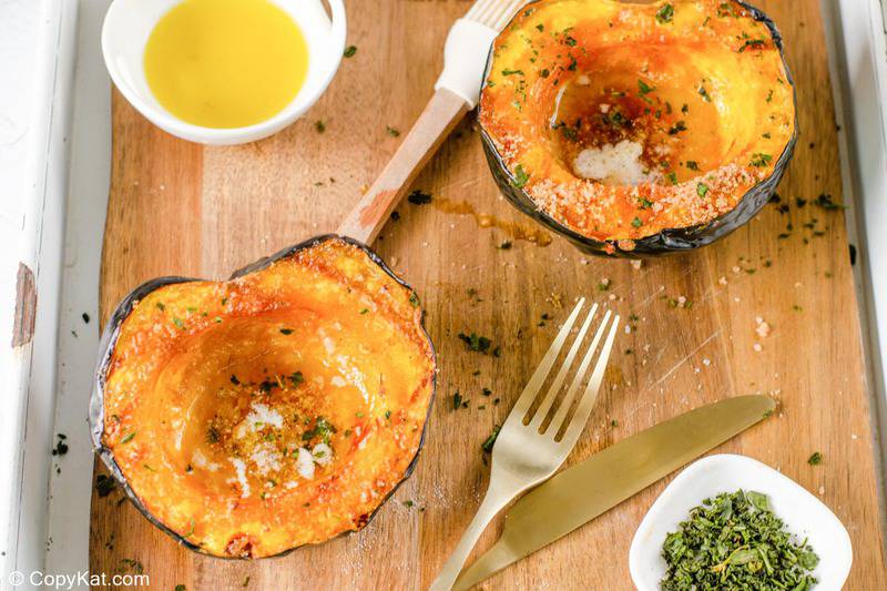air fryer acorn squash, melted butter, and chopped parsley.