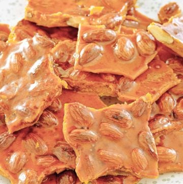 homemade almond brittle on a plate.