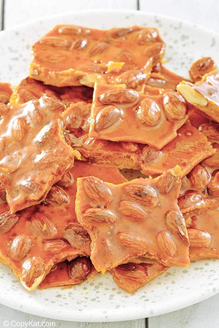 homemade almond brittle on a plate.