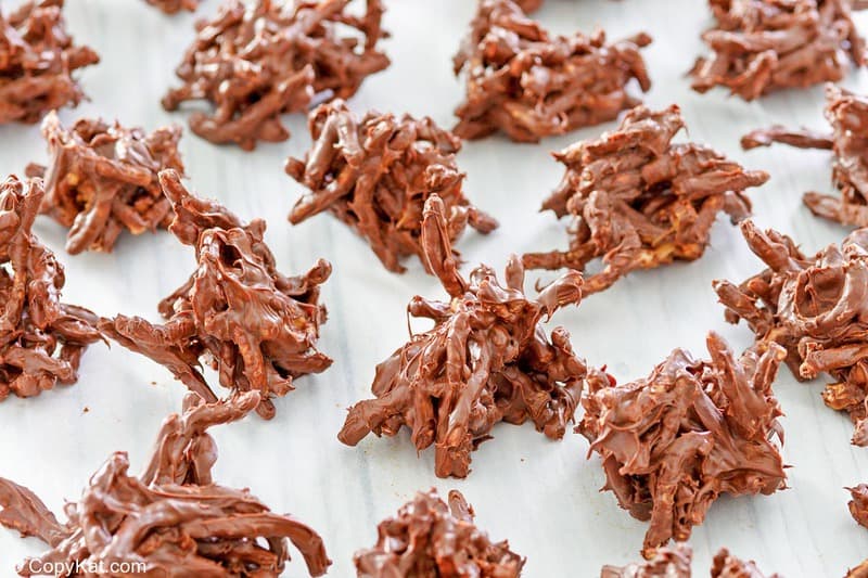 chocolate butterscotch haystacks no bake cookies on wax paper.