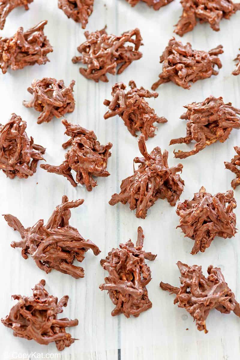 overhead view of chocolate butterscotch haystacks on wax paper.