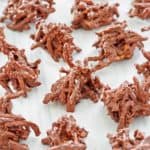 chocolate butterscotch haystacks scattered on wax paper.