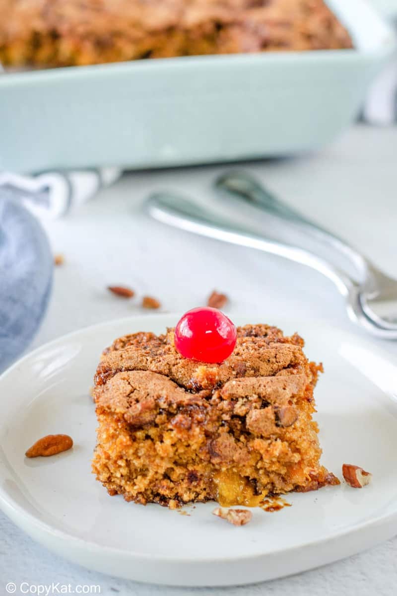 fruit cocktail cake slice on a plate.