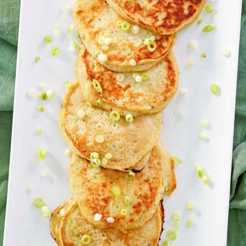 overhead view of mashed potato pancakes on a platter.