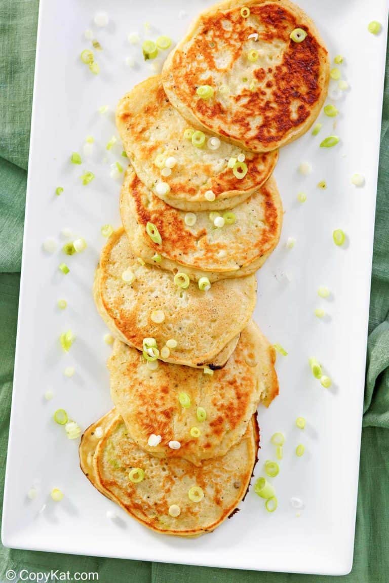 overhead view of mashed potato pancakes on a platter.