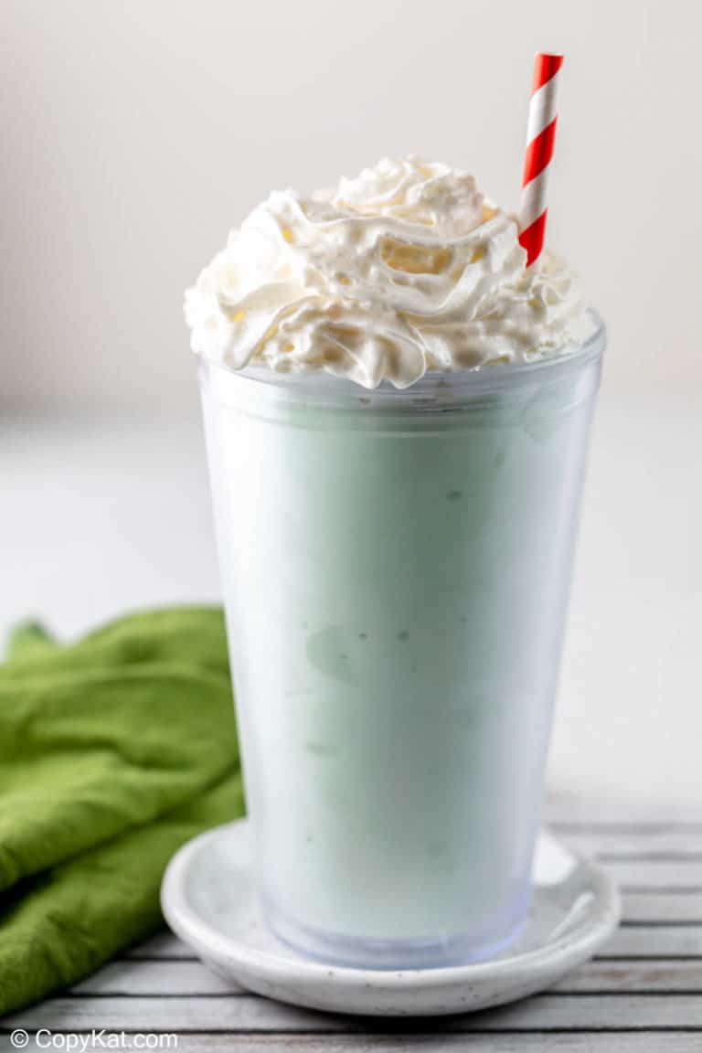 homemade McDonald's Shamrock Shake and a green kitchen towel.