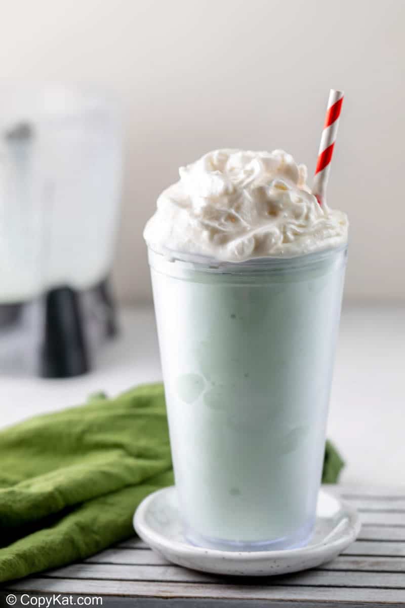 homemade shamrock shake topped with whipped cream.