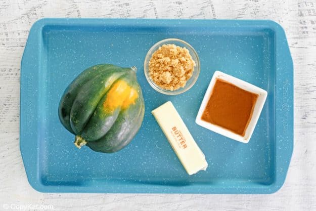 microwave acorn squash ingredients on a tray.