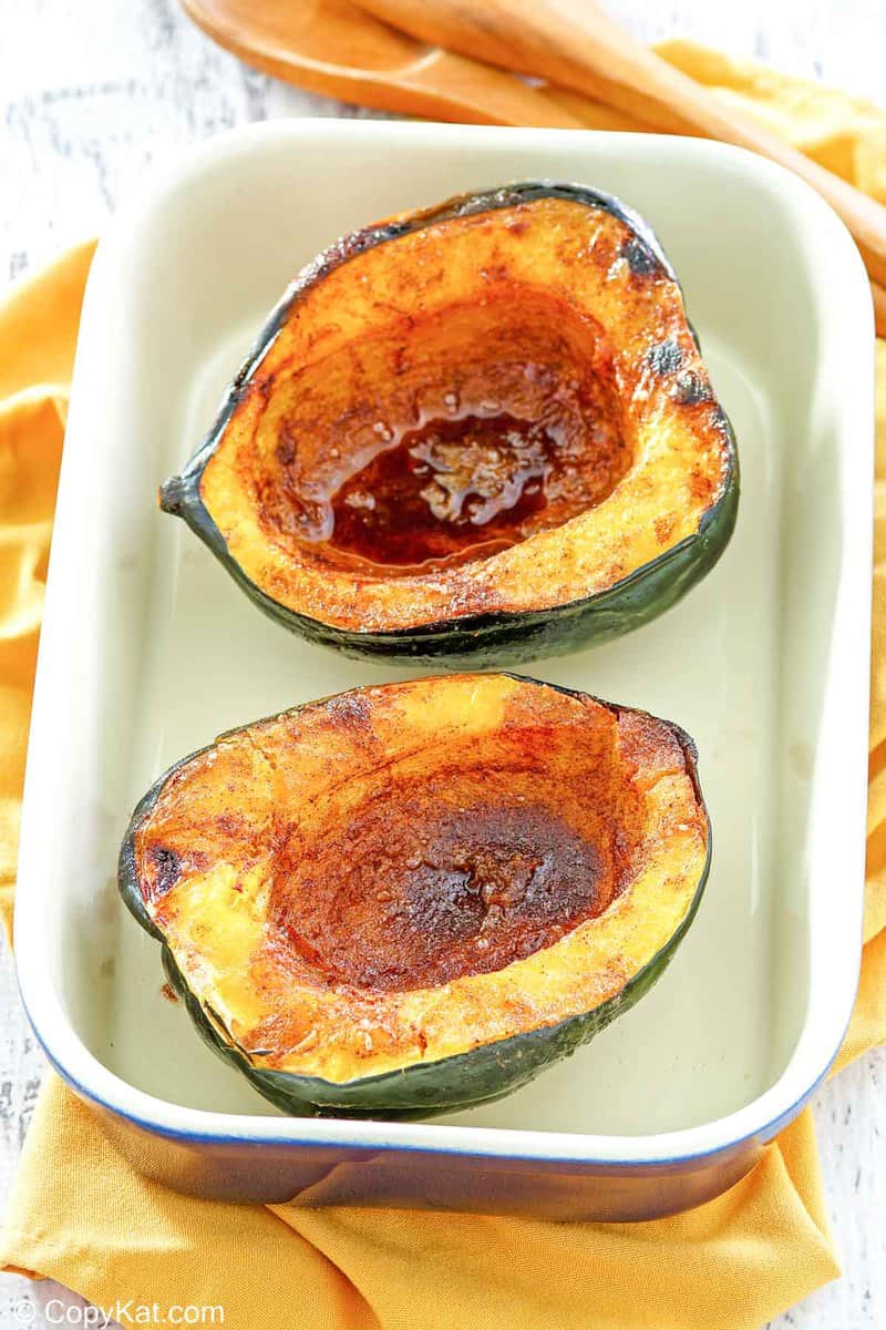 microwave acorn squash in a serving dish.