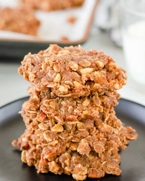 a stack of no bake chocolate oatmeal cookies on a plate.