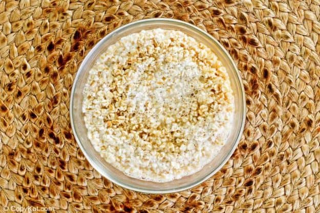 oatmeal, water, salt, and half and half in a bowl.