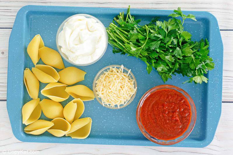 Olive Garden giant cheese stuffed shells ingredients on a tray.