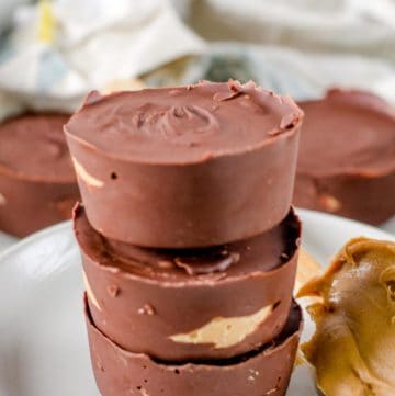 a stack of homemade Reese's peanut butter cups on a plate.