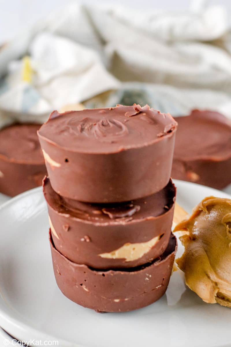 a stack of homemade Reese's peanut butter cups on a plate.