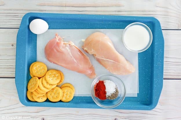 Ritz cracker chicken ingredients on a tray.