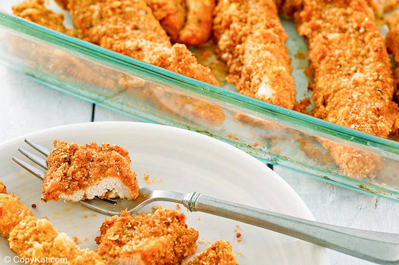 Ritz cracker chicken in a baking dish and on a plate.