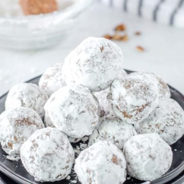 a stack of rum balls on a plate.