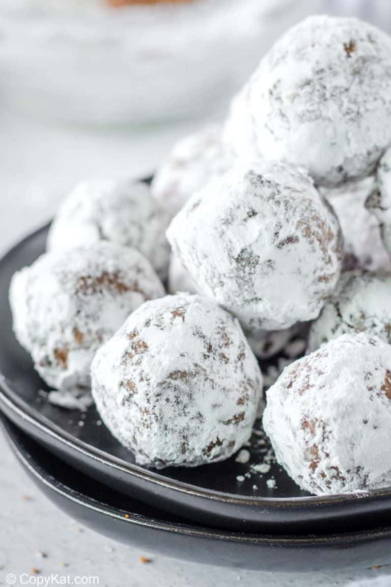 a pile of rum balls on a plate.