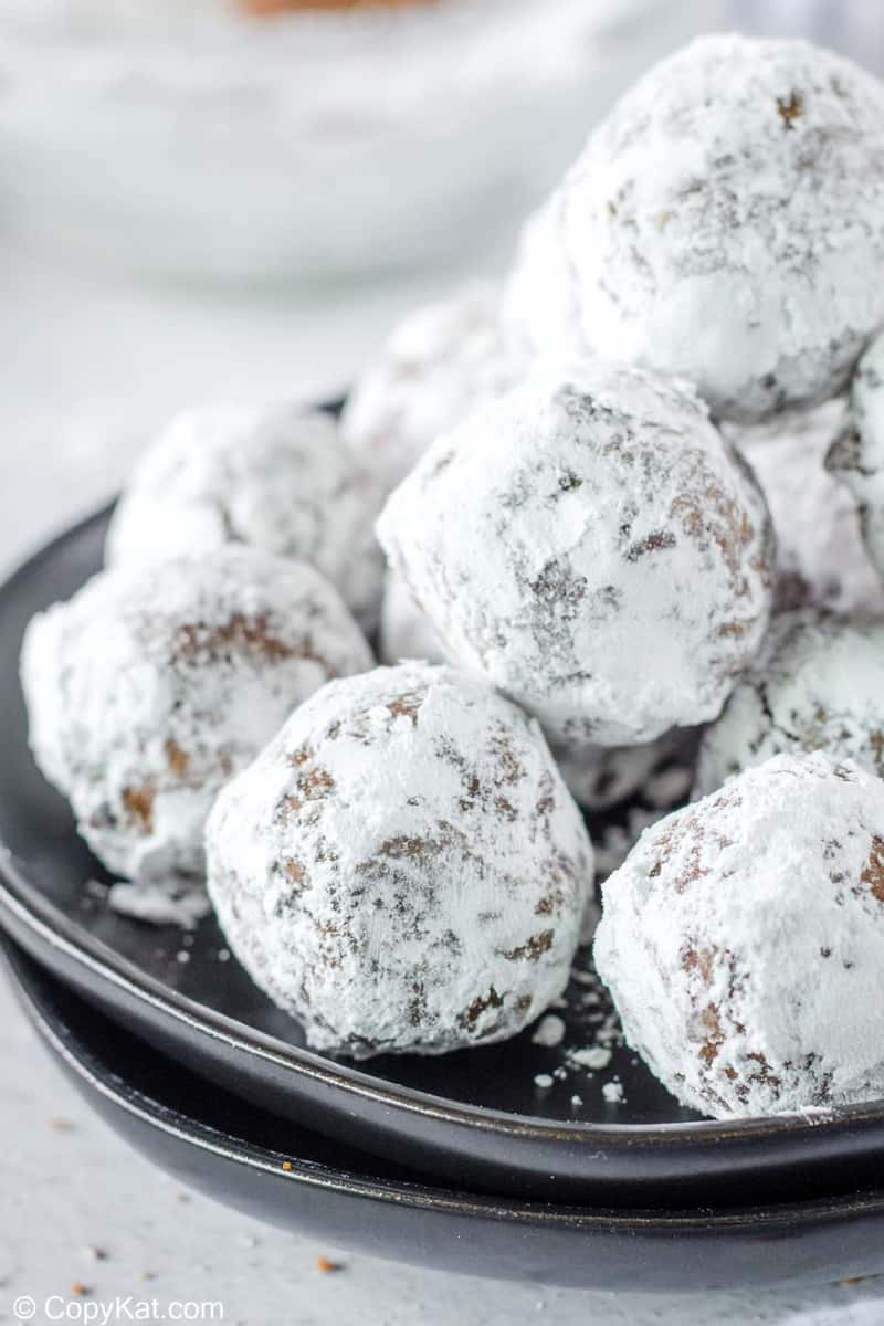 a pile of rum balls on a plate.