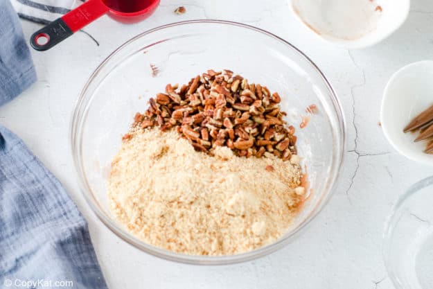 crushed vanilla wafers and pecans in a bowl.