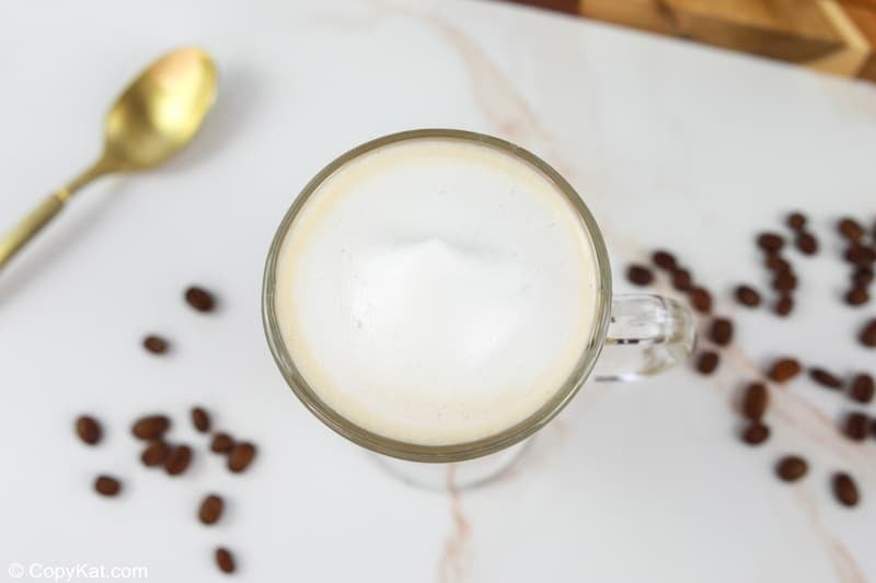 overhead view of a homemade Starbucks flat white coffee.