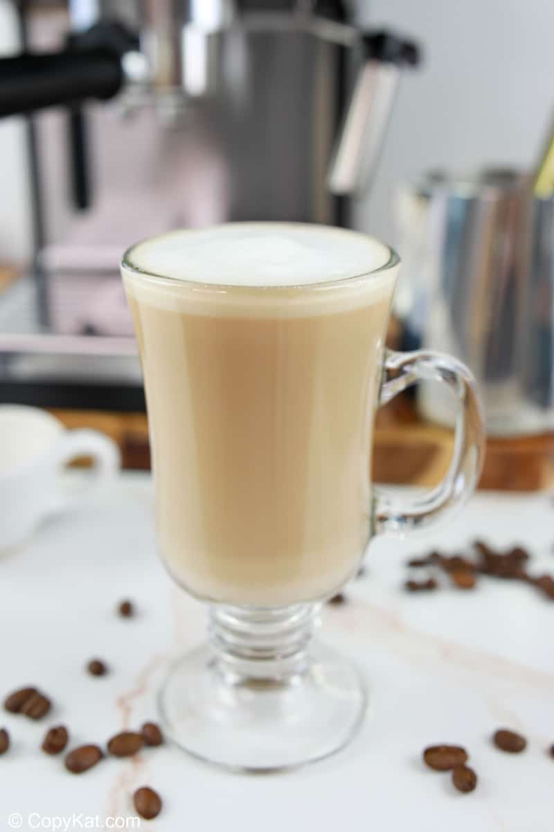 homemade Starbucks flat white coffee and coffee beans.