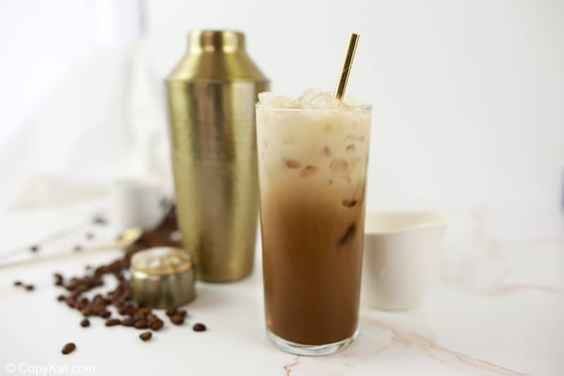 homemade Starbucks iced brown sugar oatmilk shaken espresso coffee drink and a shaker.