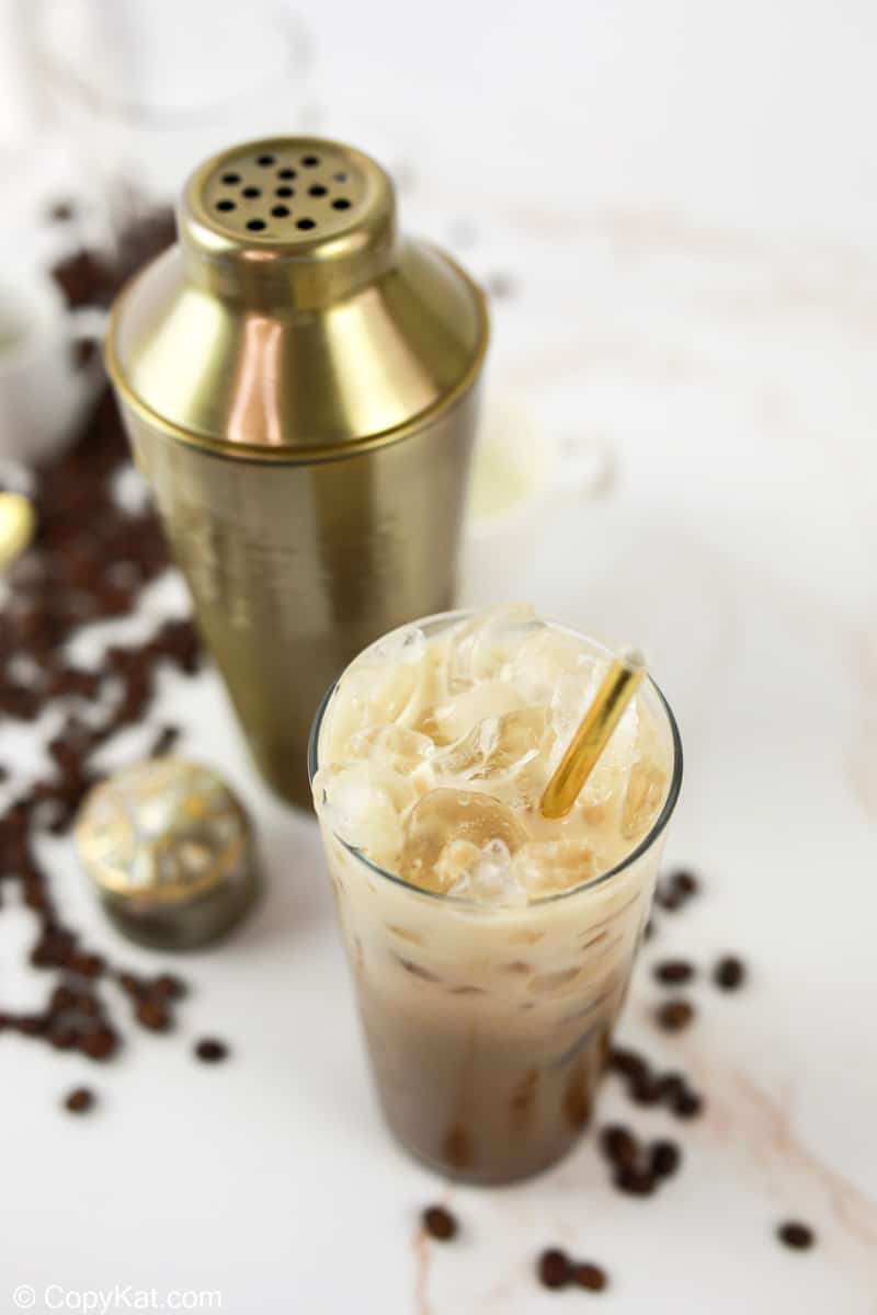 homemade Starbucks iced brown sugar oatmilk shaken espresso and a shaker.