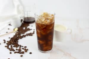 espresso, brown sugar syrup, and ice in a glass.