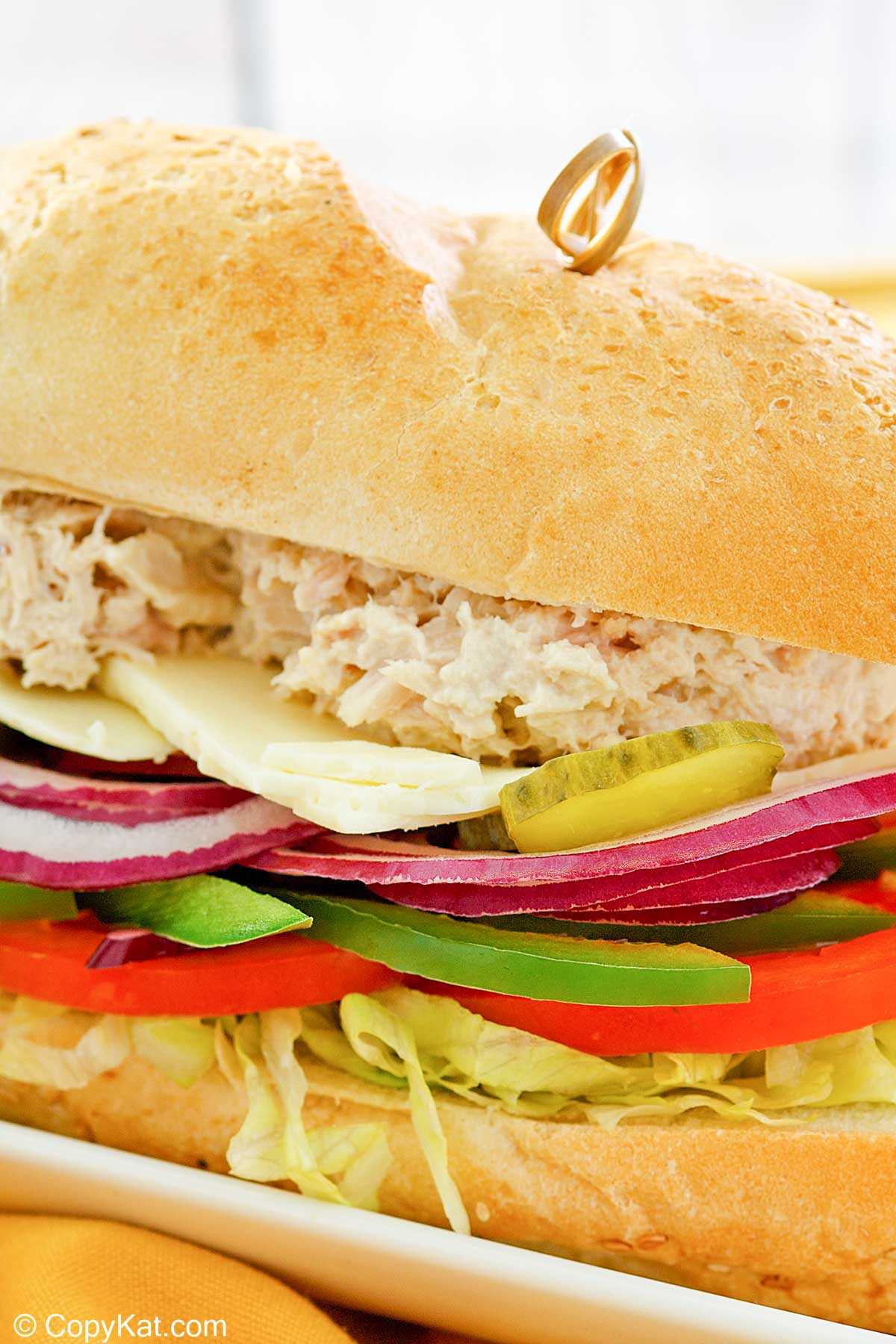 closeup of a homemade Subway tuna salad sandwich.