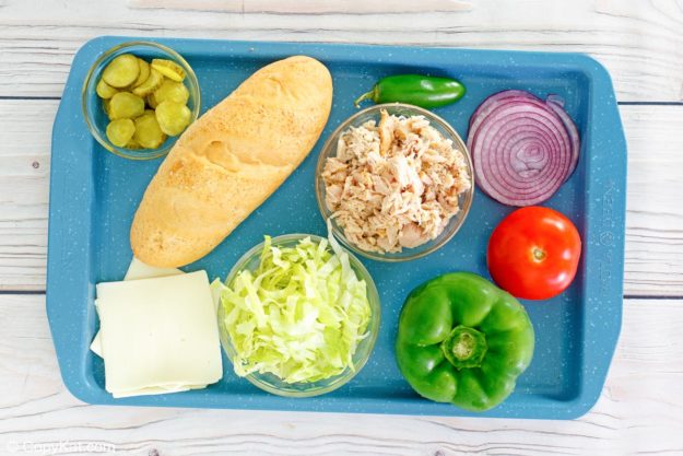 Subway tuna salad sandwich ingredients on a tray.