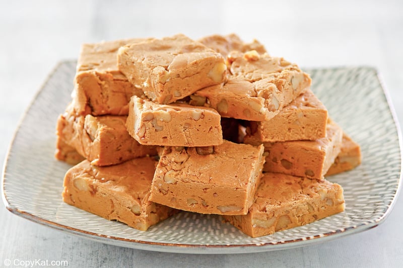 buttermilk fudge with nuts on a plate.