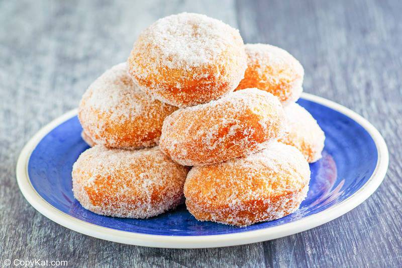 homemade Chinese sugar donuts on a blue plate.