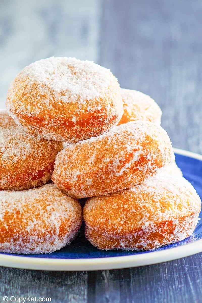 a stack on homemade Chinese sugar donuts on a plate.