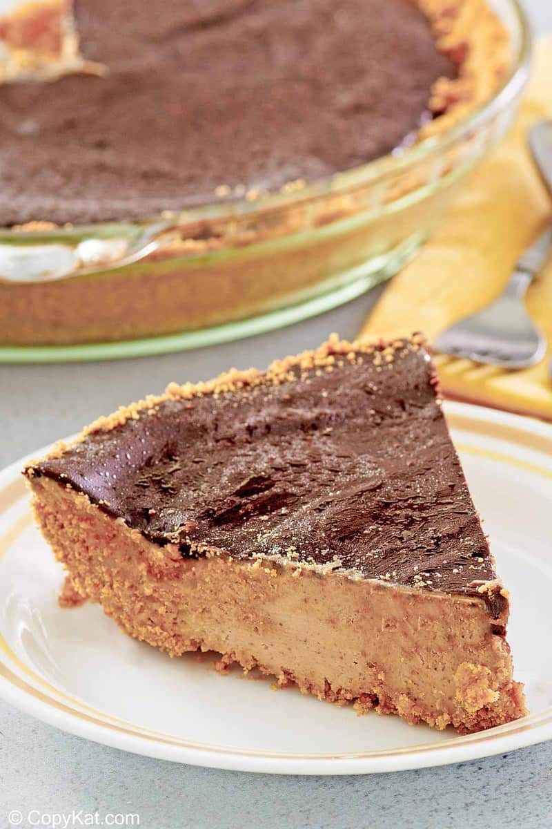 slice of chocolate peanut butter pie in front of the pie.