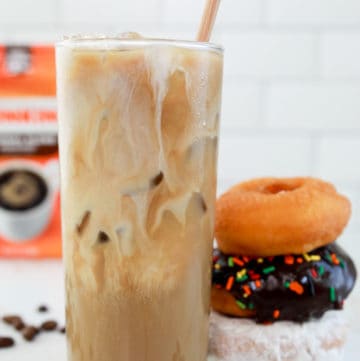 homemade Dunkin Donuts iced coffee with milk and donuts.