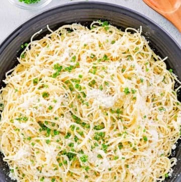 overhead view of garlic butter pasta in a serving bowl.