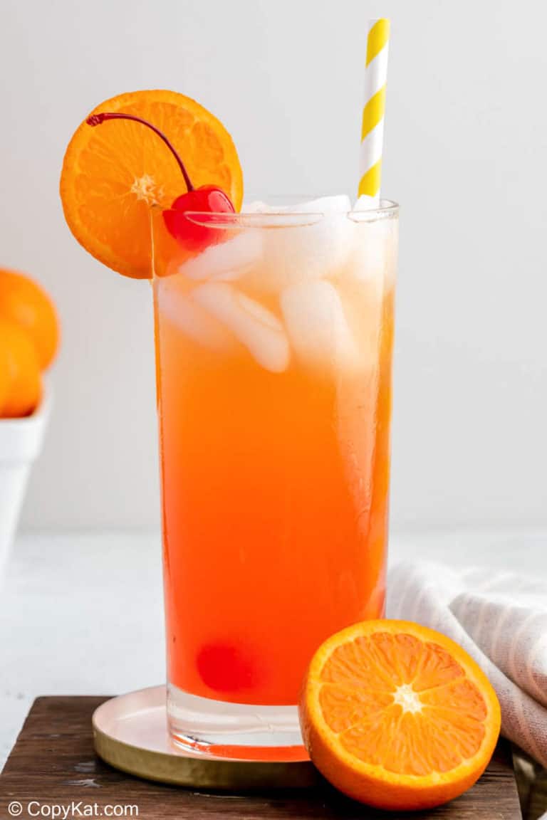 homemade Olive Garden Venetian Sunset drink garnished with a cherry and orange slice.