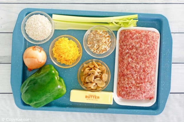 sausage and rice casserole ingredients on a tray.