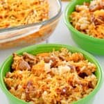 sausage and rice casserole in two bowls and a baking dish.