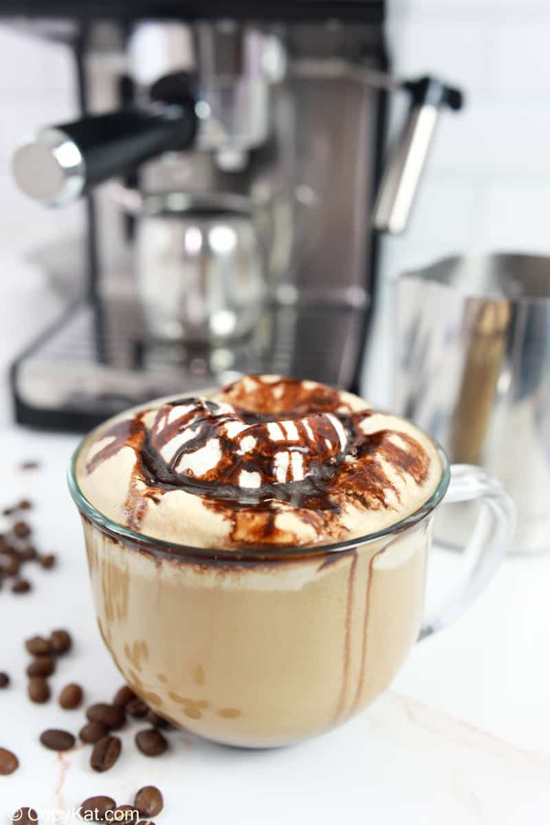 homemade Starbucks cafe mocha in front of an espresso machine.