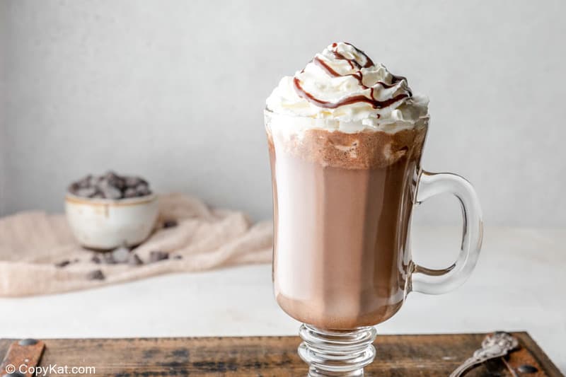 homemade Starbucks hot chocolate with whipped cream and chocolate syrup on top.